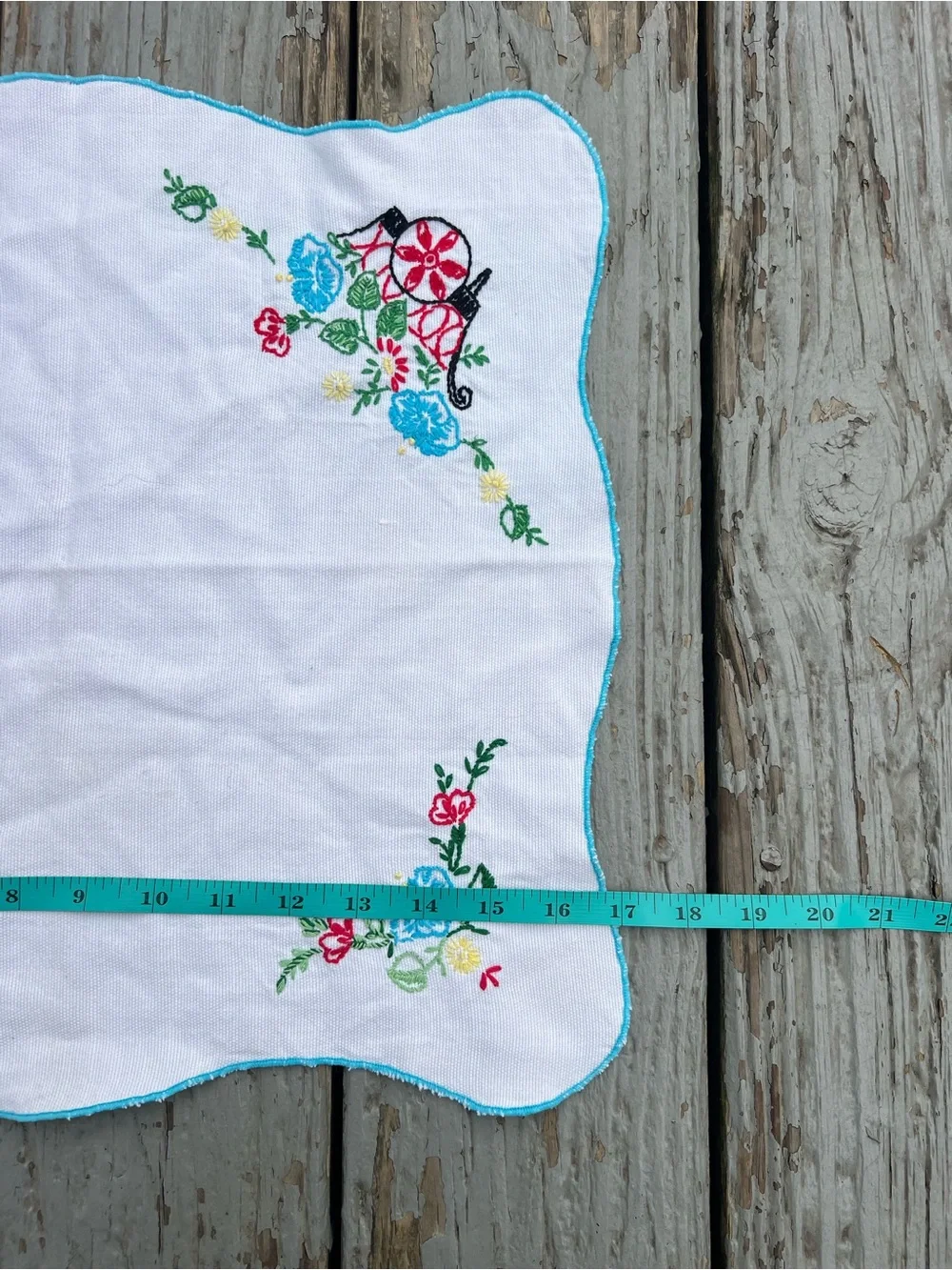 Vintage White Embroidered Table Linen with Blue and Red Floral Accents